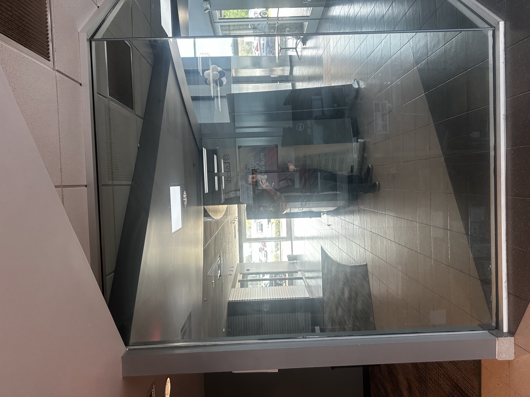 Interior glass conference room wall with mirror-effect film