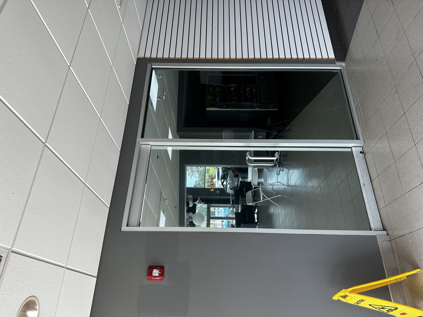 Tinted glass office door inside a dealership